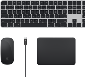 Mac-tillbehören Magic Keyboard, Magic Mouse, Magic Trackpad, och Thunderbolt-kablar sedda ovanifrån.